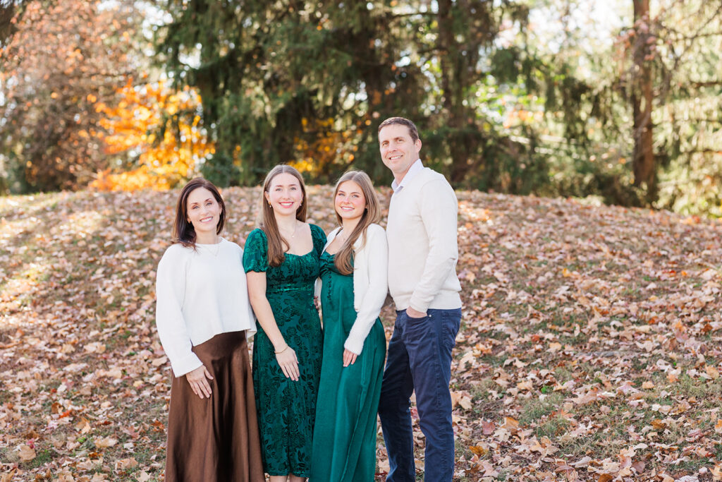 Coordinated family outfits in brown, green and cream tones