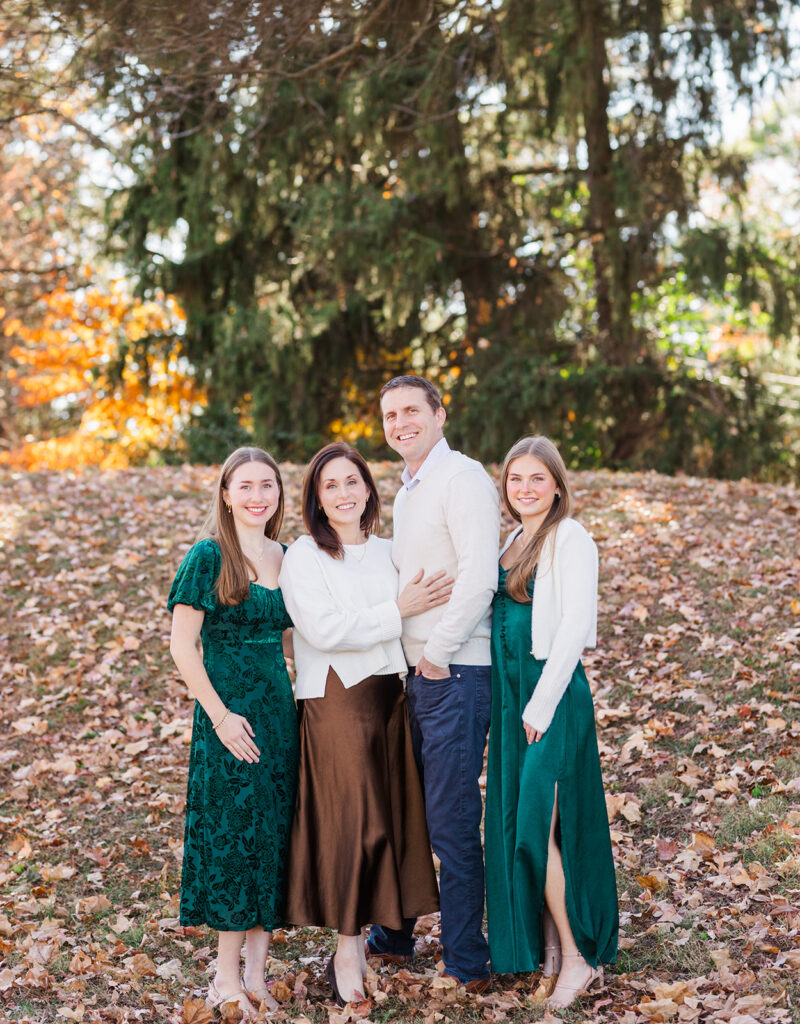 Family wearing neutral outfits during outdoor photo session in Columbus Ohio