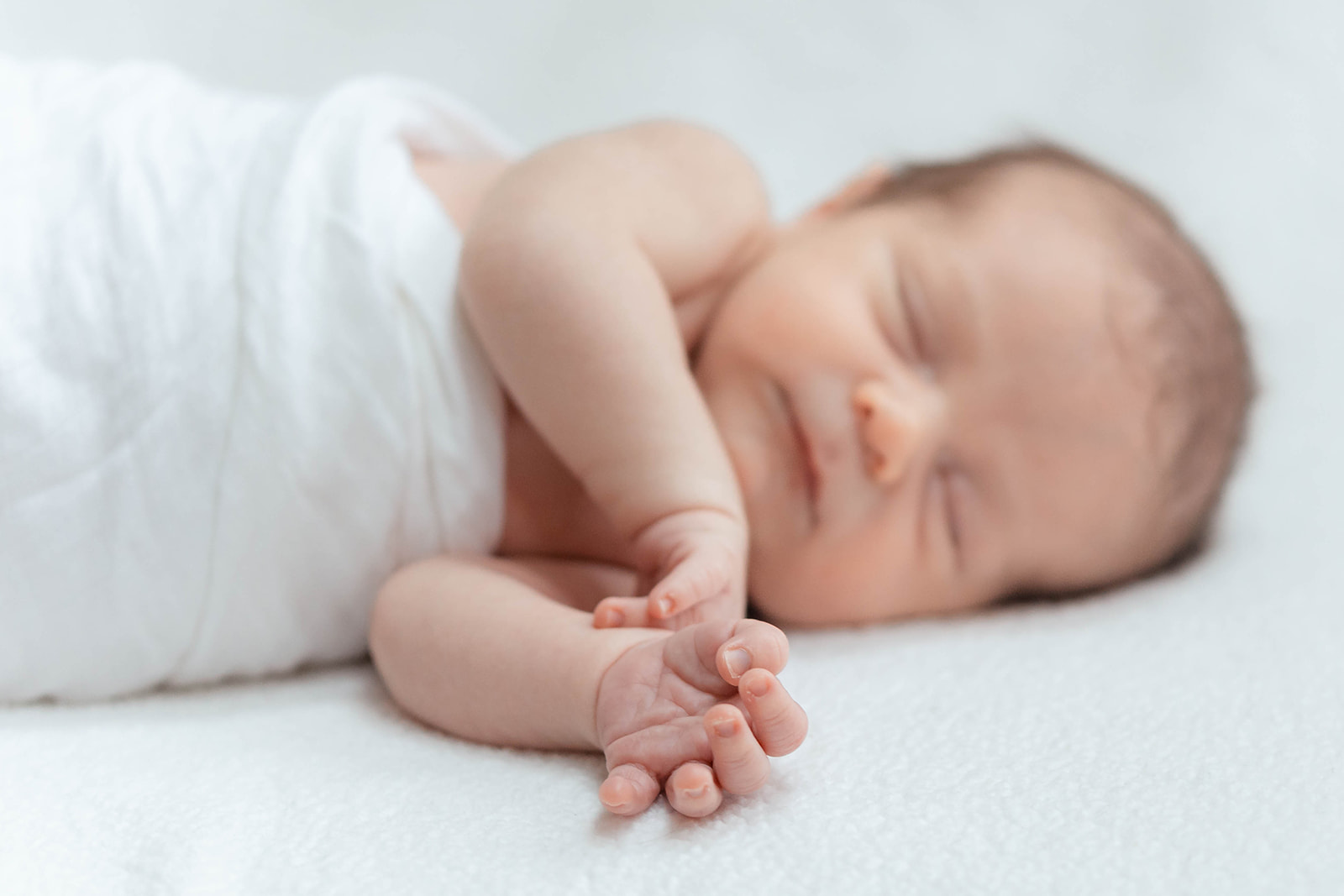 Details of a sleeping newborn baby's hands night nurse columbus ohio
